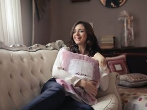 woman sitting on a comfortable sofa
